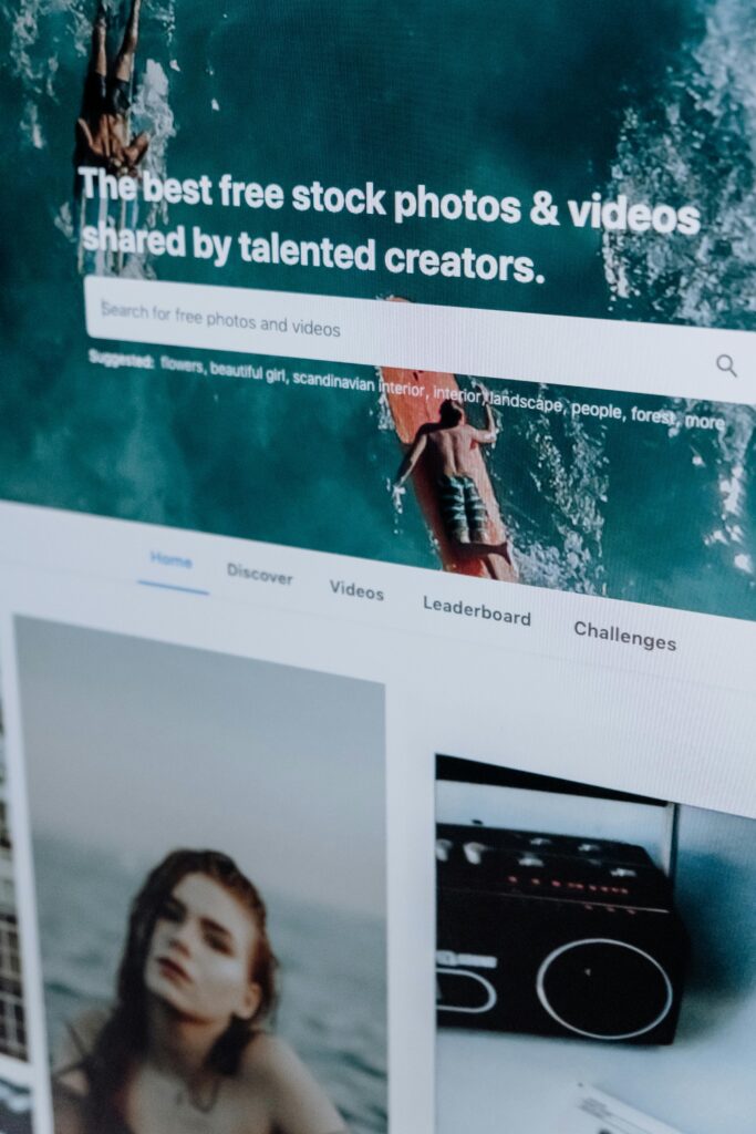 Close-up of a computer screen showing a stock photo website interface with multiple images.